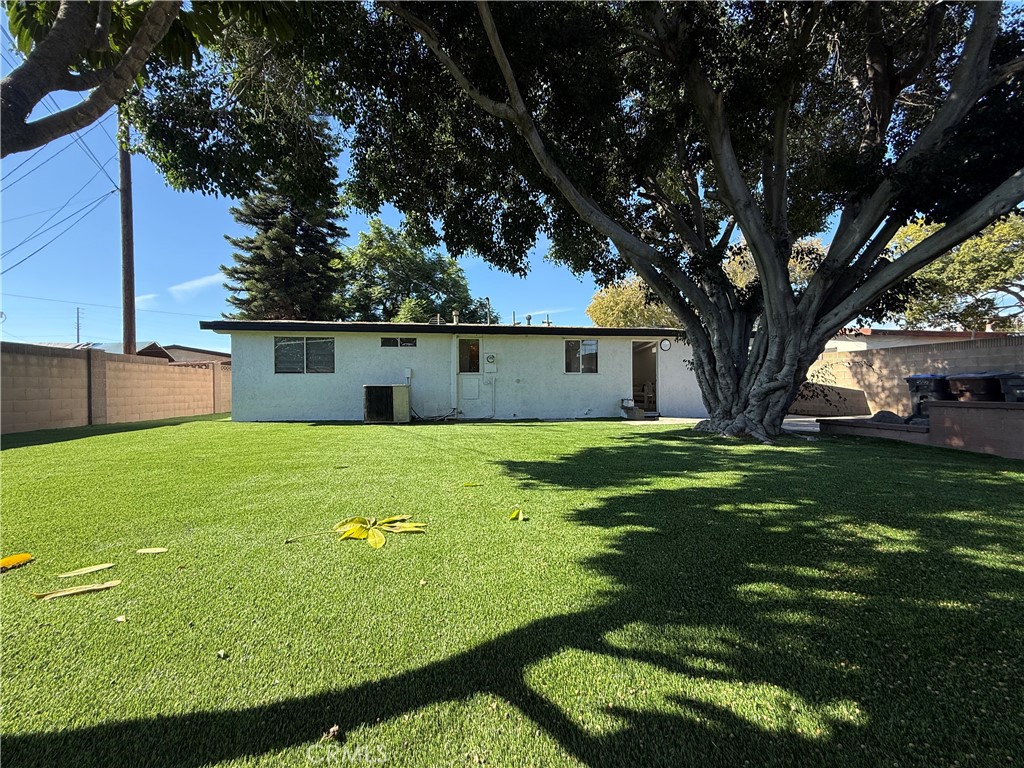 2540 West Picadilly Way Anaheim, CA 92801 - Photo 36 of 37 a front view of a house with a yard