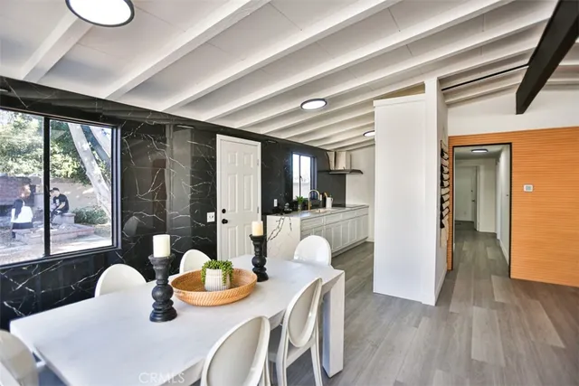 a outdoor dining space with furniture and a kitchen view