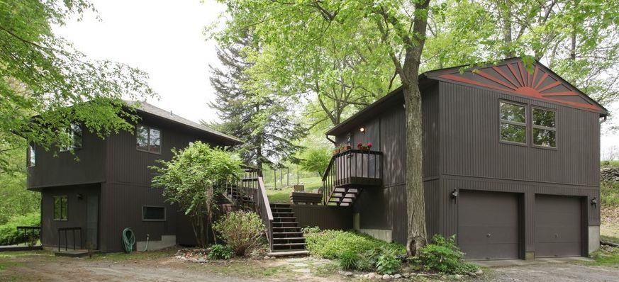 a front view of a house with garden