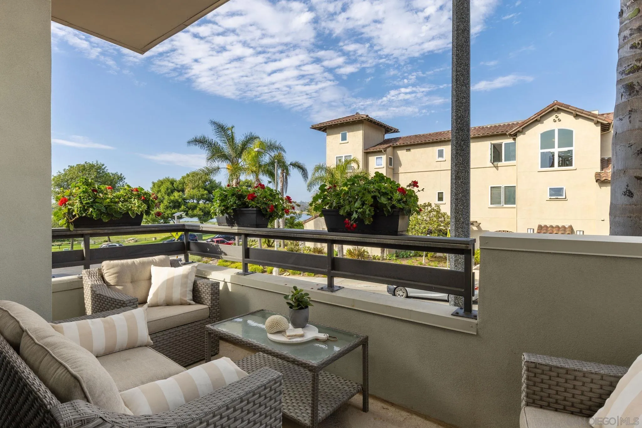 2521 State Street Carlsbad, CA 92008 - Photo 12 of 30 a roof deck with couches and potted plants