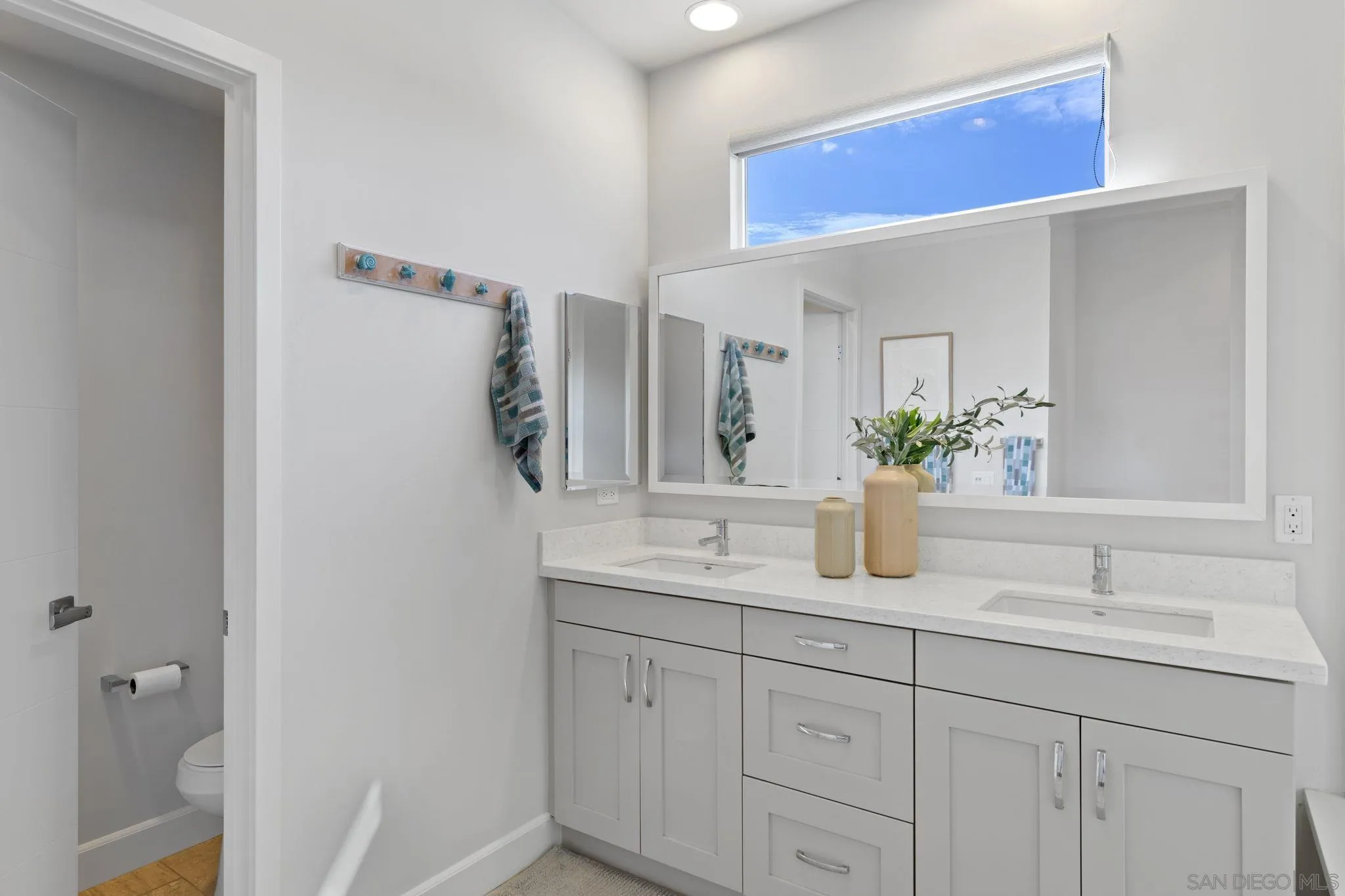 2521 State Street Carlsbad, CA 92008 - Photo 15 of 30 a bathroom with a granite countertop sink and a mirror