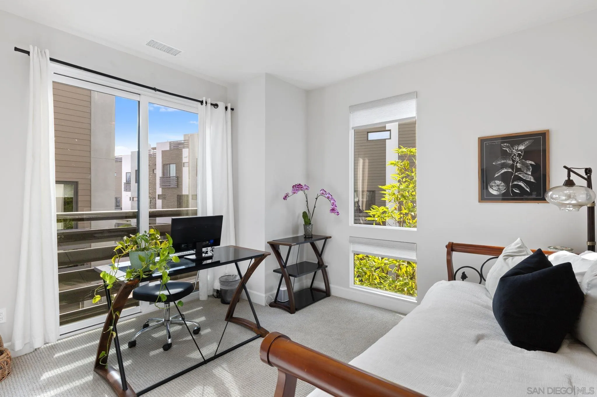 2521 State Street Carlsbad, CA 92008 - Photo 17 of 30 a living room with furniture and a potted plant