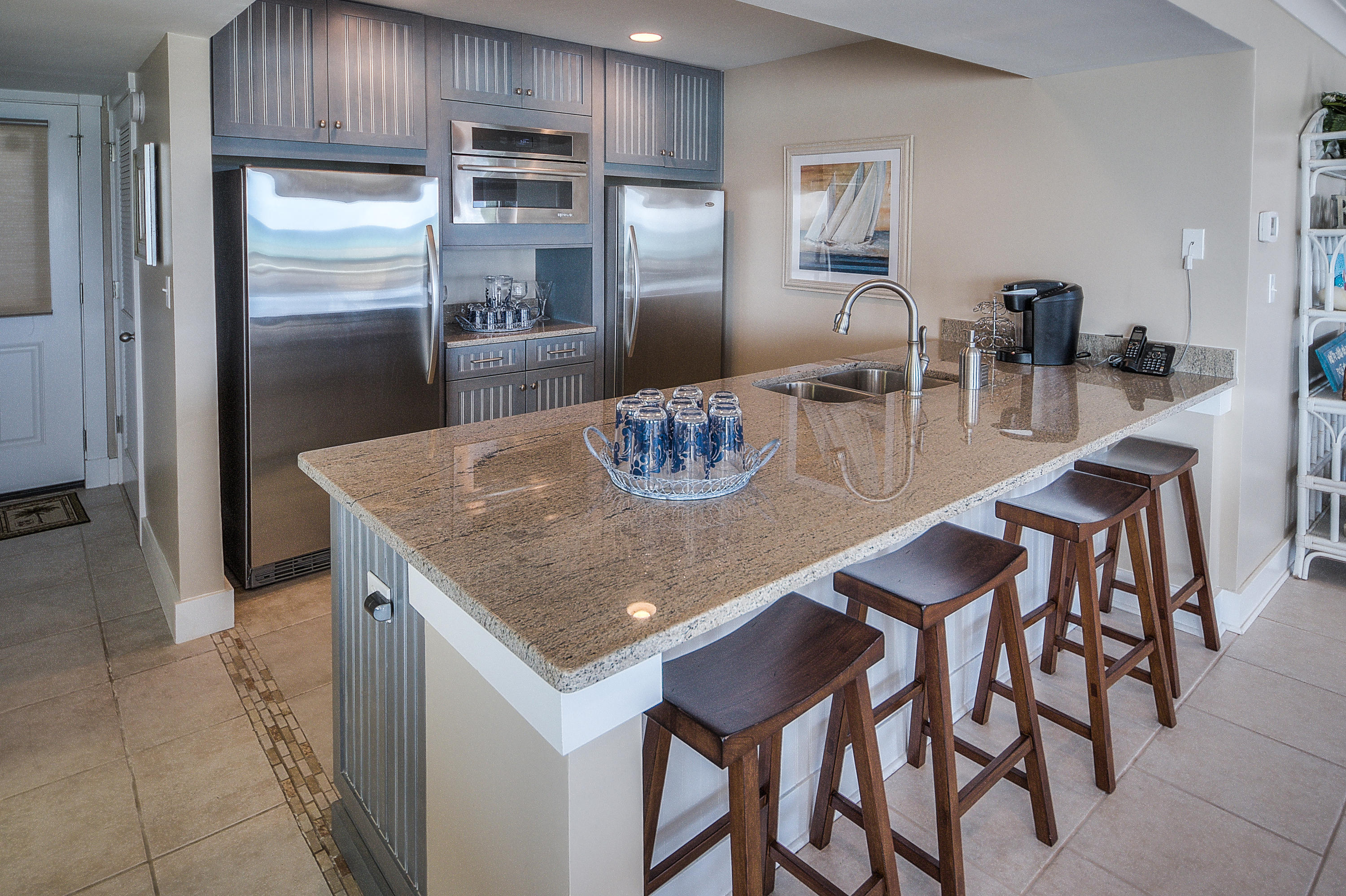 43 Fort Panic Road Santa Rosa Beach, FL 32459 - Photo 36 of 44 a kitchen with stainless steel appliances granite countertop a dining table and chairs