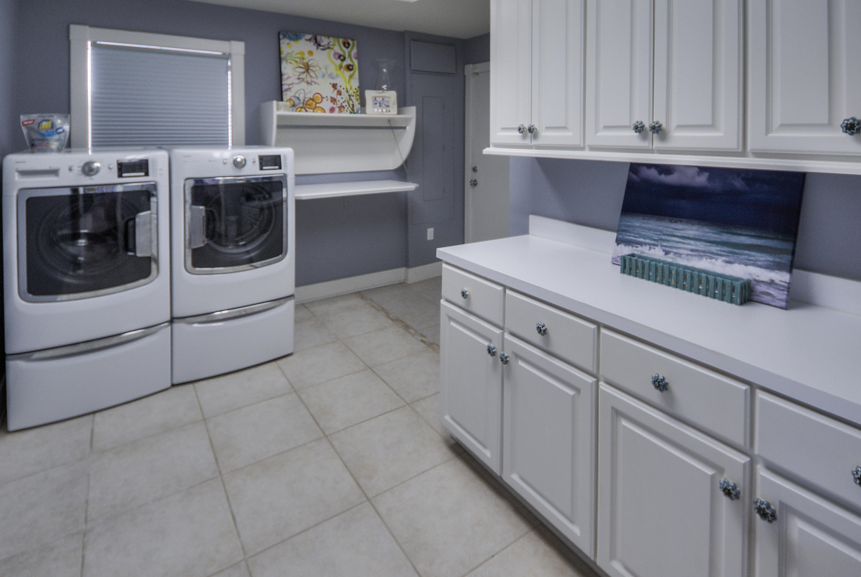 43 Fort Panic Road Santa Rosa Beach, FL 32459 - Photo 39 of 44 a kitchen with white cabinets and white appliances