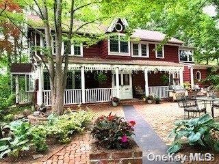 44 Grove Street Cold Spring Harbor, NY 11724 - Photo 1 of 1 a front view of a house with a yard