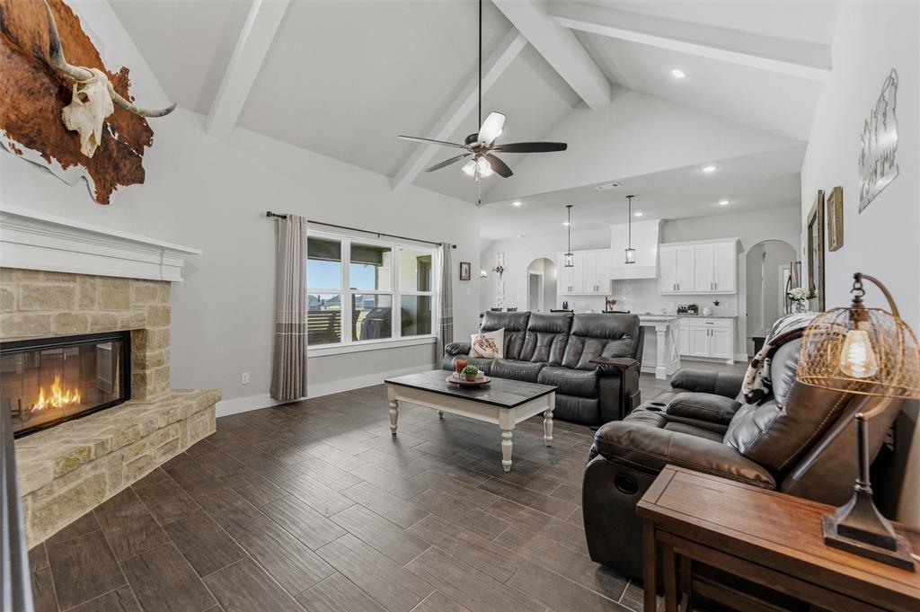 3020 Westfork Way Springtown, TX 76082 - Photo 12 of 40 a living room with furniture and a fireplace