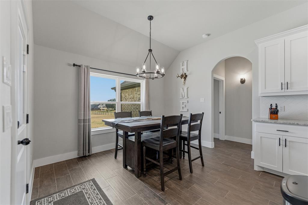 3020 Westfork Way Springtown, TX 76082 - Photo 17 of 40 a view of a dining room with furniture