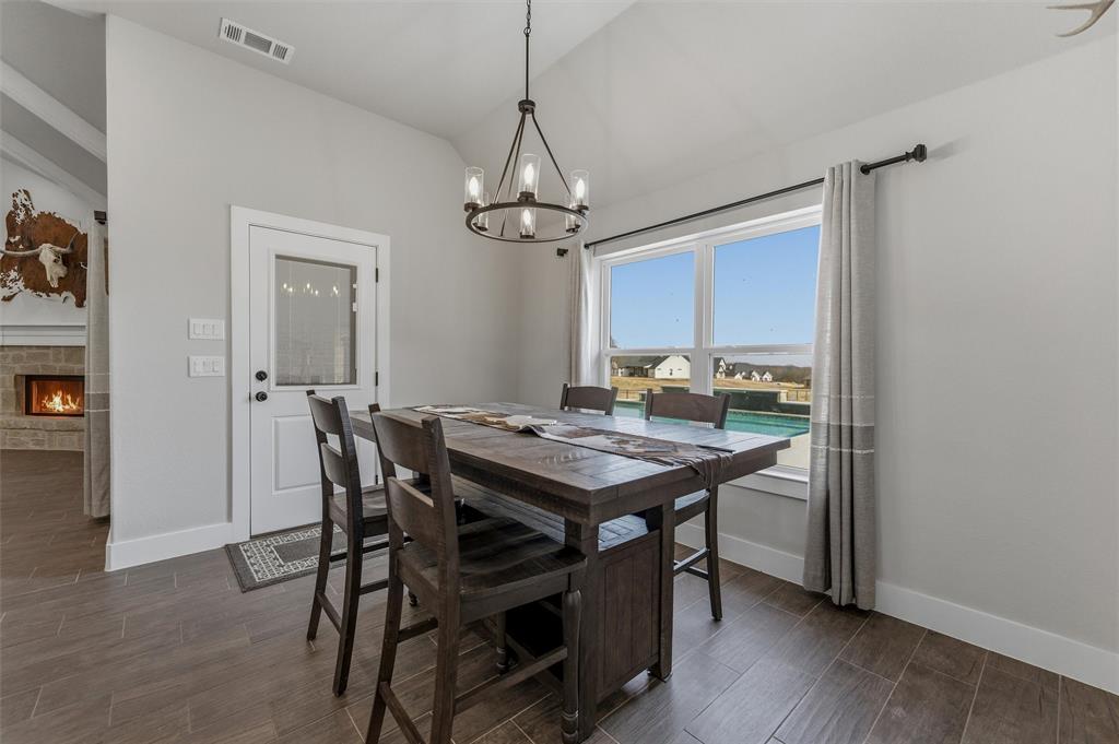 3020 Westfork Way Springtown, TX 76082 - Photo 18 of 40 a view of a dining room with a table and chairs