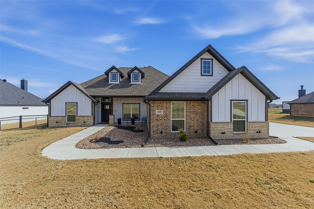 3020 Westfork Way Springtown, TX 76082 - Photo 2 of 40 a front view of a house with a yard