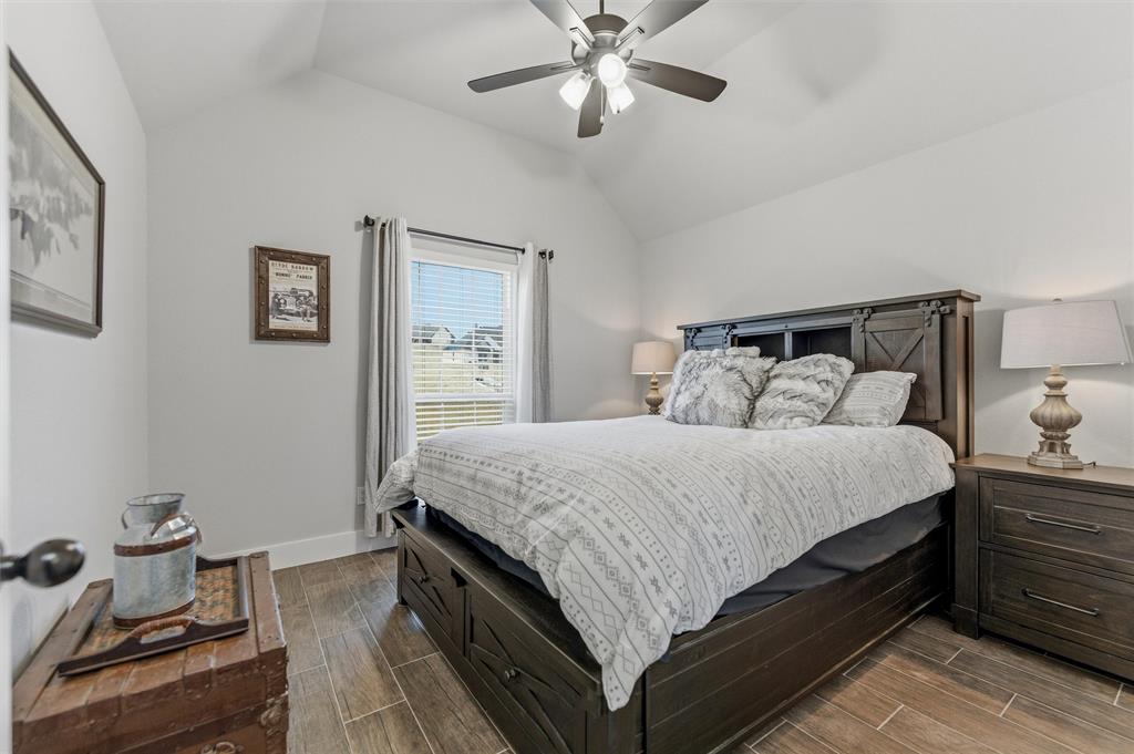 3020 Westfork Way Springtown, TX 76082 - Photo 25 of 40 a bedroom with a bed and wooden floor