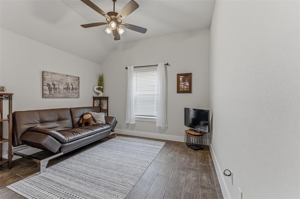 3020 Westfork Way Springtown, TX 76082 - Photo 26 of 40 a living room with furniture and a rug