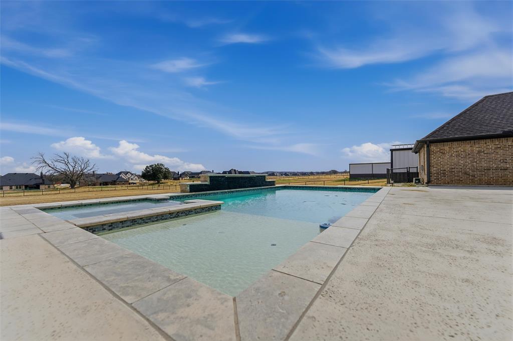 3020 Westfork Way Springtown, TX 76082 - Photo 30 of 40 a view of swimming pool outdoor outdoor seating and lake view