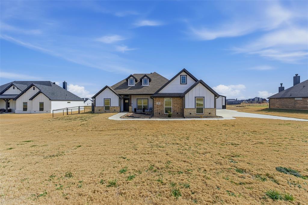 3020 Westfork Way Springtown, TX 76082 - Photo 3 of 40 a front view of a house with yard