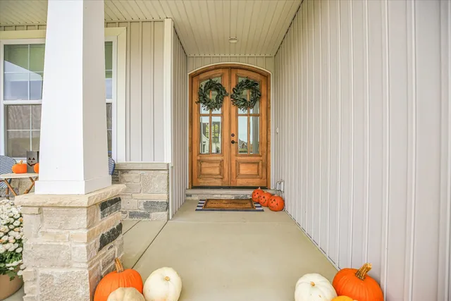 a very nice looking room with wooden floor and stairs