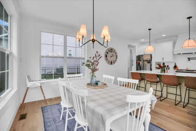 a hallway with wooden floor and closet