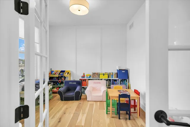 a bathroom with a sink mirror and toilet