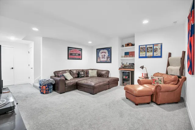 a bedroom that has a bed and a chandelier