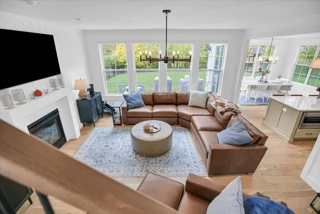 a front view of a house with sitting area