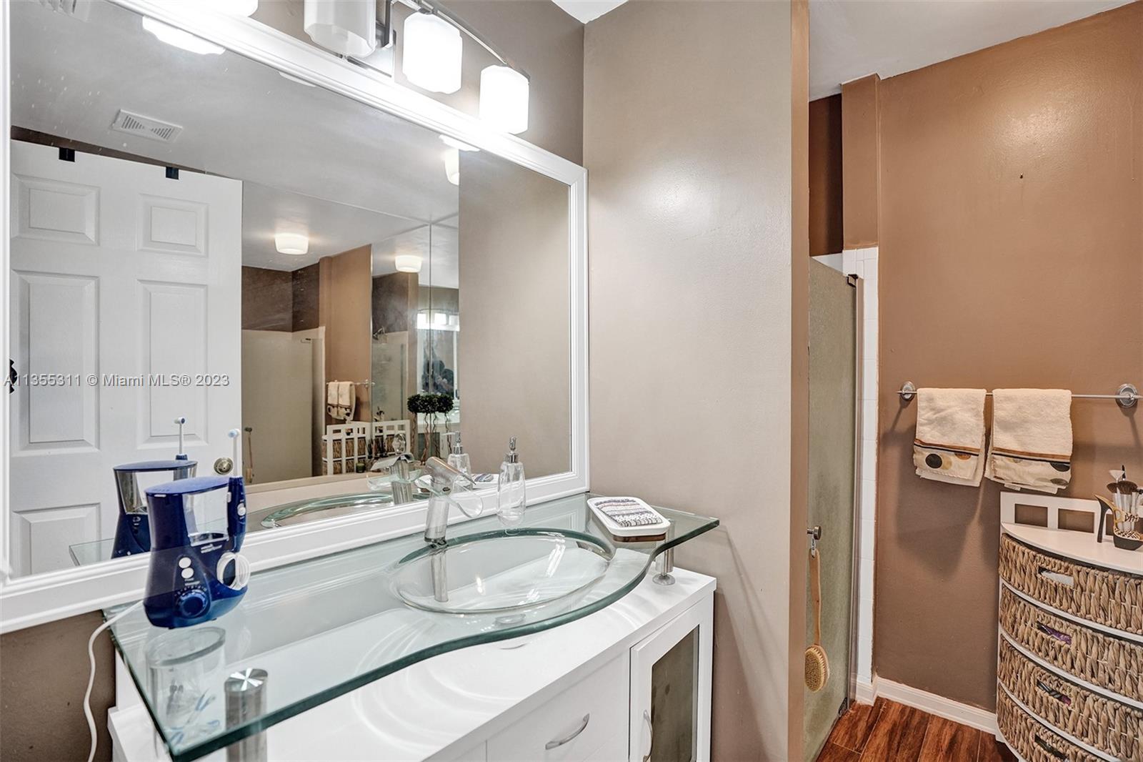 Tamarac Tamarac, FL 33321 - Photo 12 of 49 a bathroom with a sink and a mirror