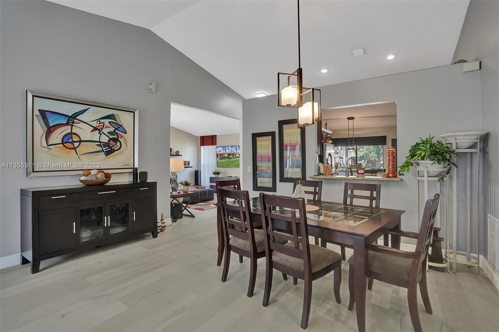 Tamarac Tamarac, FL 33321 - Photo 19 of 49 a view of a dining room with furniture window and wooden floor