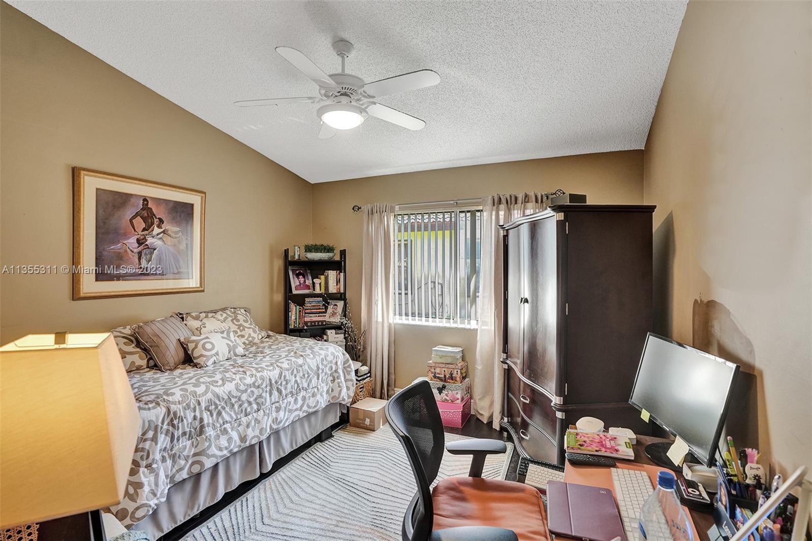 Tamarac Tamarac, FL 33321 - Photo 20 of 49 a bedroom with bed and a window