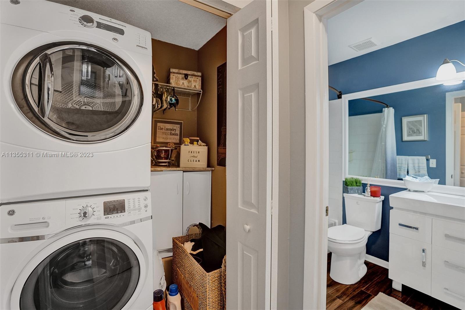 Tamarac Tamarac, FL 33321 - Photo 23 of 49 a view of a storage and utility room with dryer and washer