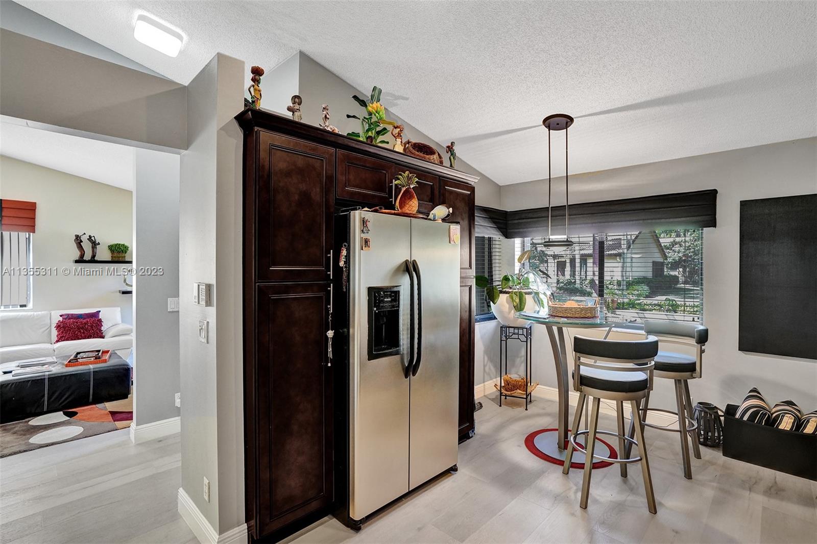 Tamarac Tamarac, FL 33321 - Photo 29 of 49 a view of a kitchen with a refrigerator and microwave