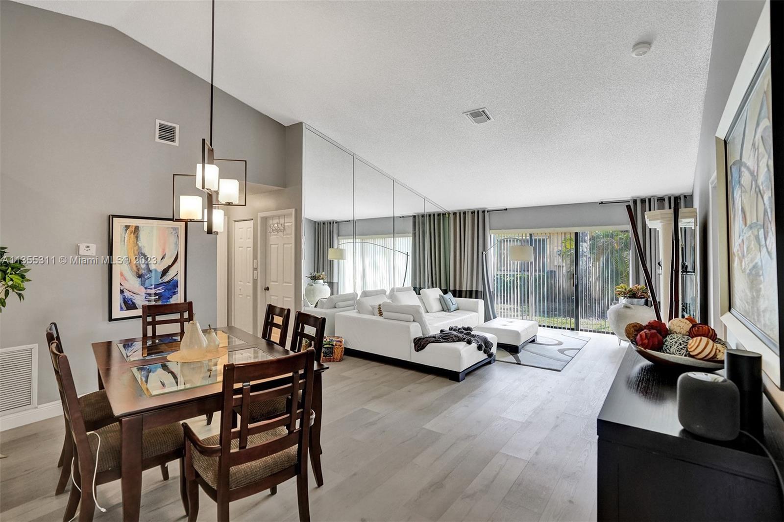 Tamarac Tamarac, FL 33321 - Photo 36 of 49 a living room with furniture and a large window