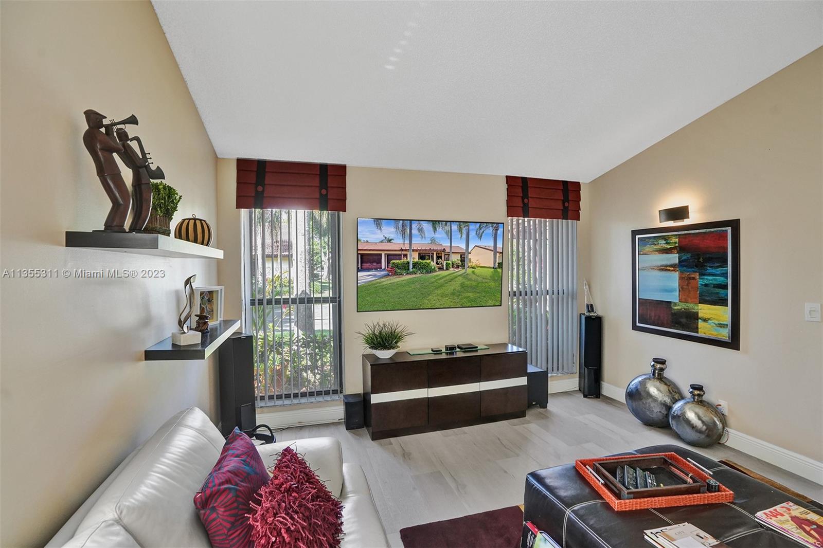 Tamarac Tamarac, FL 33321 - Photo 44 of 49 a bedroom with furniture and a book shelf