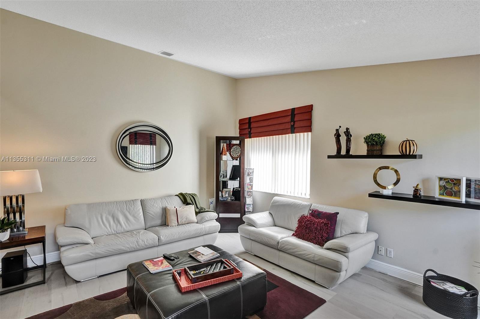 Tamarac Tamarac, FL 33321 - Photo 48 of 49 a living room with furniture and a chair