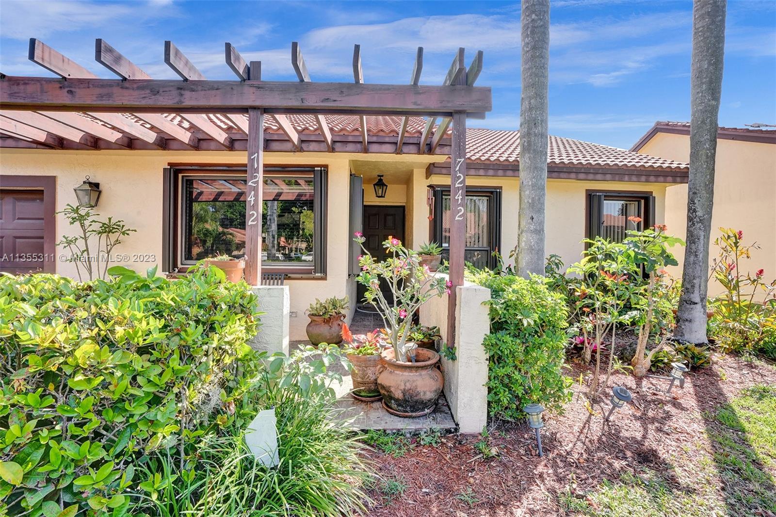 Tamarac Tamarac, FL 33321 - Photo 6 of 49 front view of a house with a large window