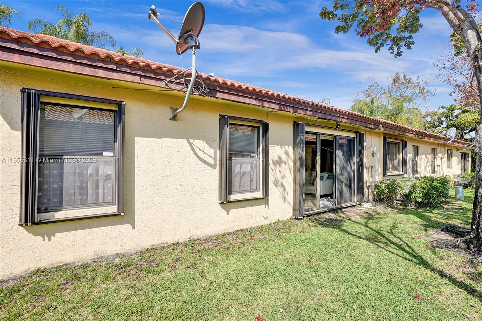 Tamarac Tamarac, FL 33321 - Photo 8 of 49 a front view of a house with garden