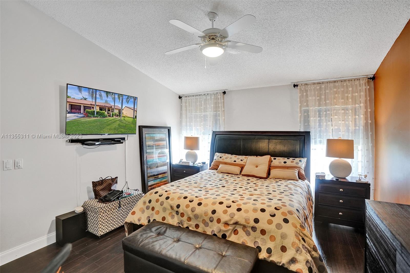 Tamarac Tamarac, FL 33321 - Photo 10 of 49 a bedroom with a bed and a flat screen tv