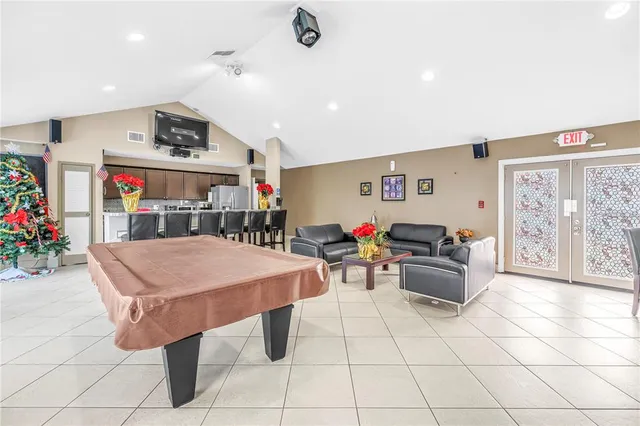 a dining area with furniture and a kitchen view