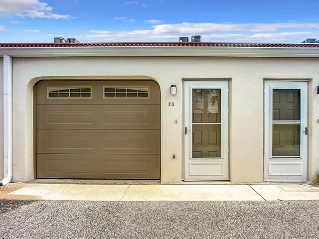 a front view of a house with a wooden fence