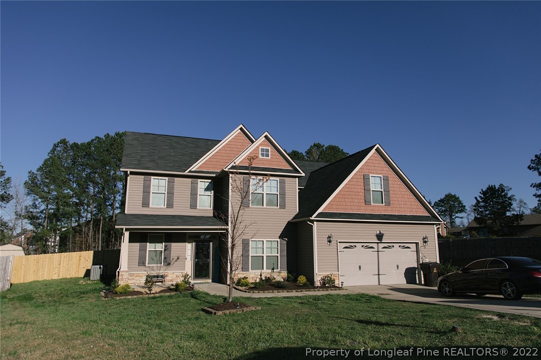 153 Shellbark Drive Spring Lake, NC 28390 - Photo 1 of 48 a front view of a house with a yard