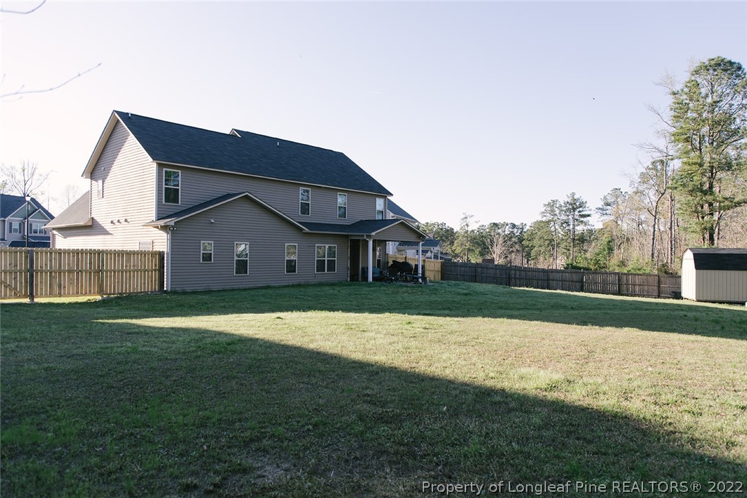 153 Shellbark Drive Spring Lake, NC 28390 - Photo 2 of 48 a house view with a outdoor space