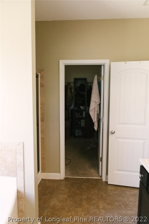 153 Shellbark Drive Spring Lake, NC 28390 - Photo 25 of 48 a view of a hallway with wooden floor