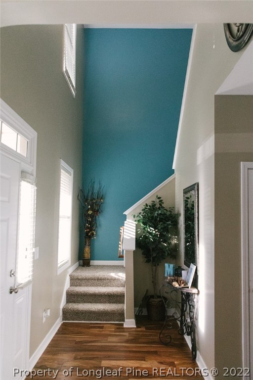 153 Shellbark Drive Spring Lake, NC 28390 - Photo 27 of 48 a view of a hallway with wooden floor and a potted plant