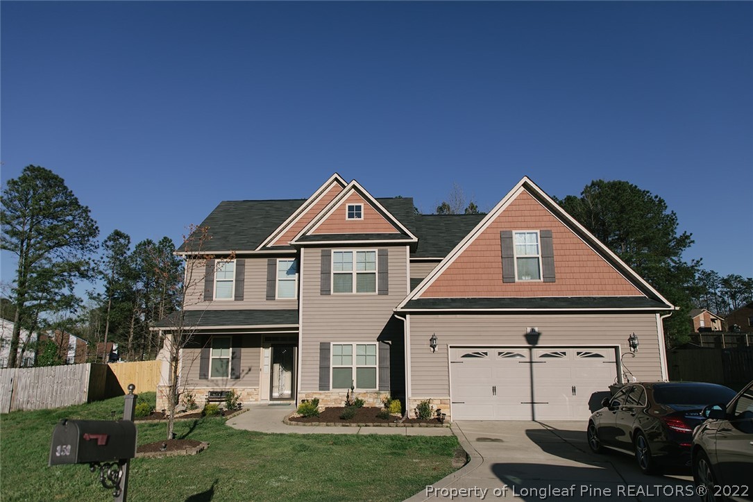 153 Shellbark Drive Spring Lake, NC 28390 - Photo 3 of 48 a view of a yard in front of house