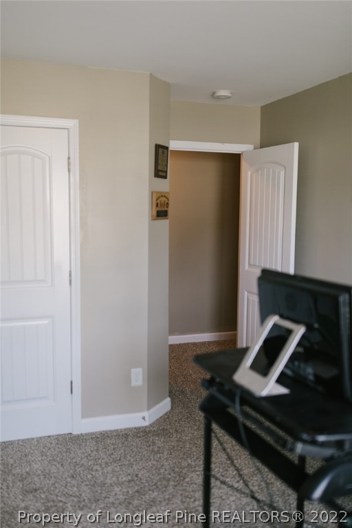 153 Shellbark Drive Spring Lake, NC 28390 - Photo 34 of 48 a view of an empty room with wooden floor