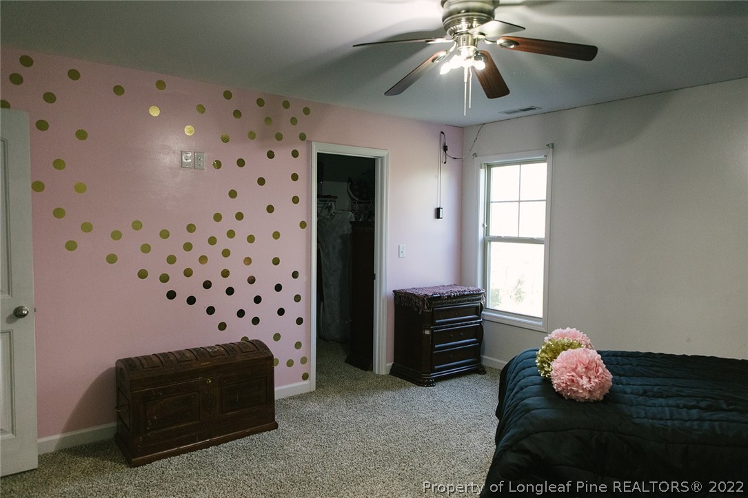 153 Shellbark Drive Spring Lake, NC 28390 - Photo 44 of 48 a bedroom with furniture and a window