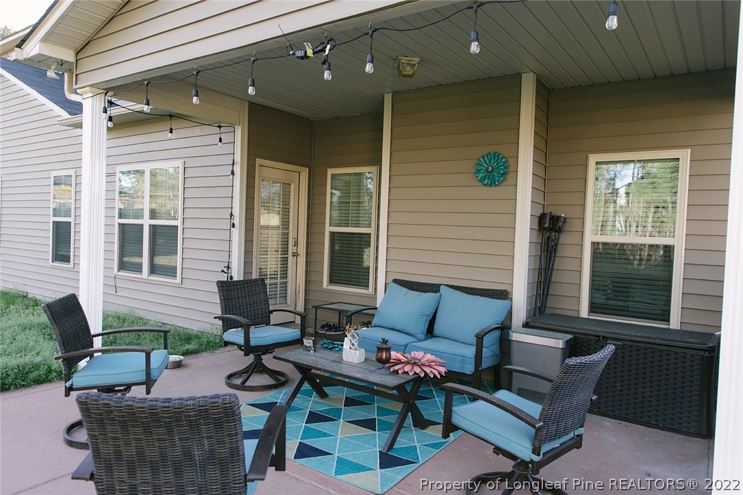 153 Shellbark Drive Spring Lake, NC 28390 - Photo 47 of 48 a balcony with furniture and a potted plant