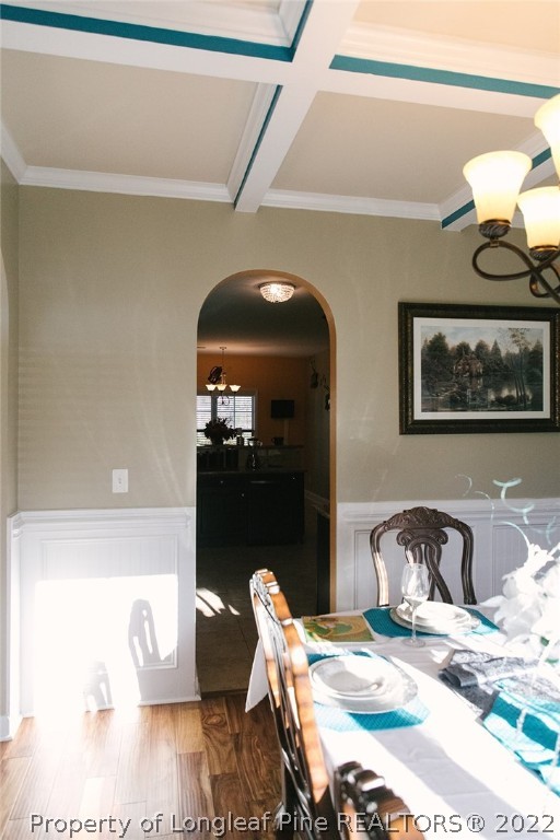 153 Shellbark Drive Spring Lake, NC 28390 - Photo 6 of 48 a bedroom with a bed and wooden floor