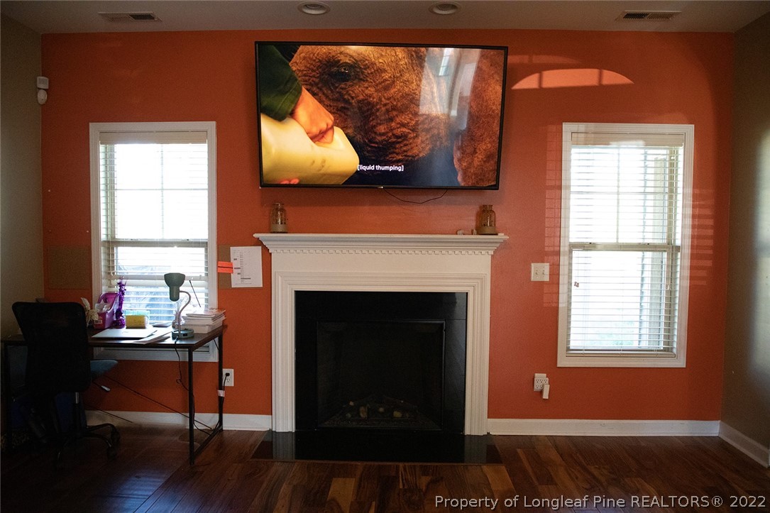 153 Shellbark Drive Spring Lake, NC 28390 - Photo 7 of 48 a living room with furniture and a fireplace
