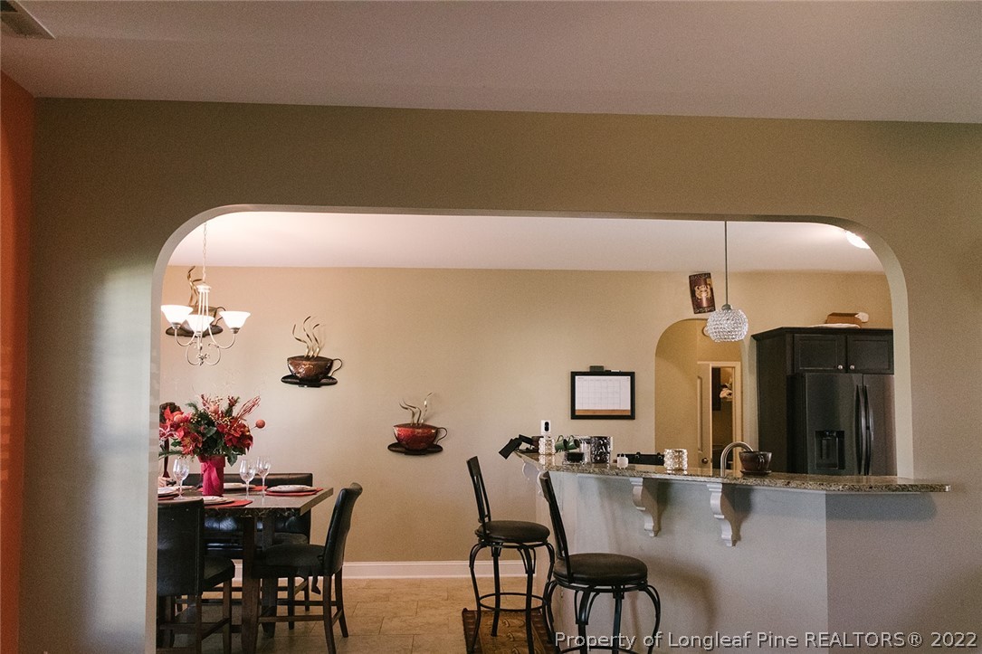 153 Shellbark Drive Spring Lake, NC 28390 - Photo 10 of 48 a dining room with furniture and window