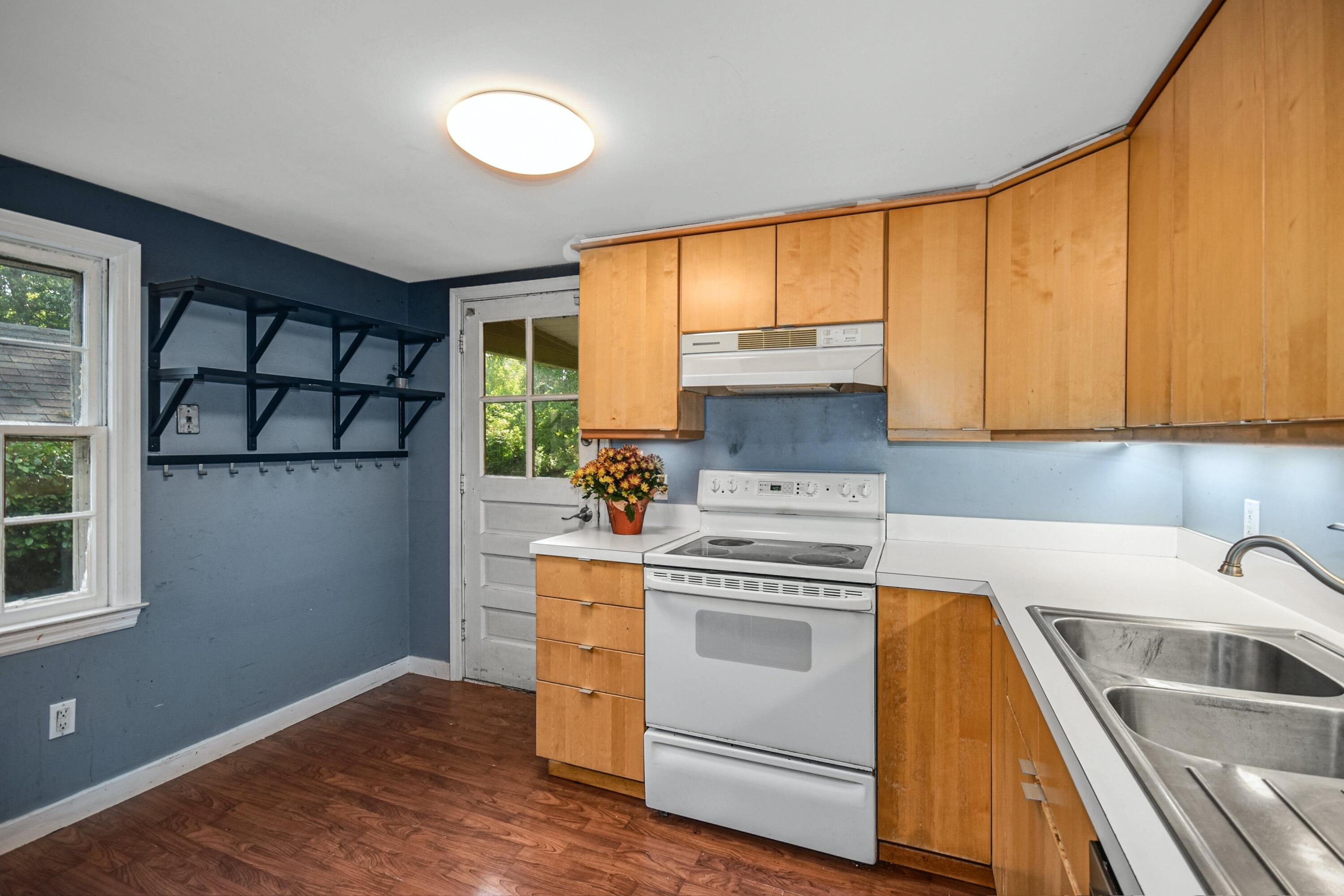 16 Burchard Lane Rowayton, CT 06853 - Photo 12 of 22 a kitchen with a stove a sink and a refrigerator