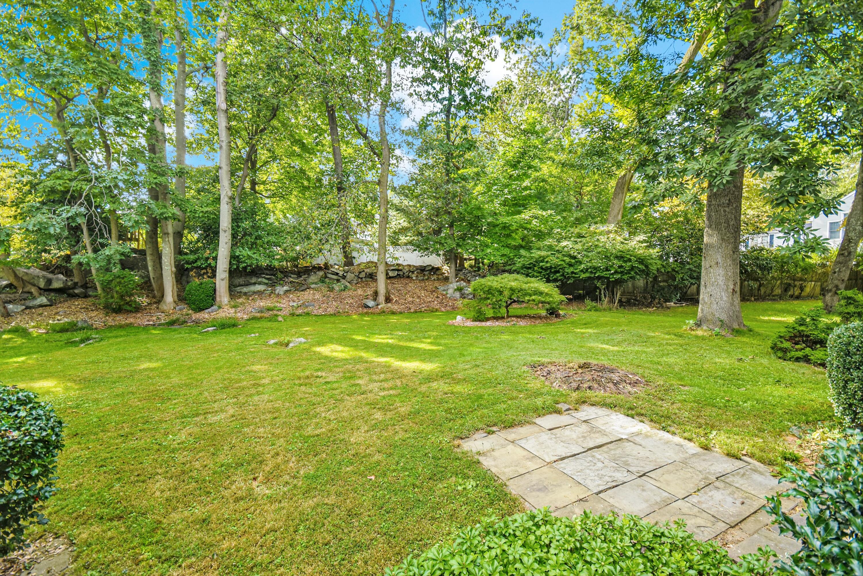 16 Burchard Lane Rowayton, CT 06853 - Photo 17 of 22 a view of a backyard with a garden