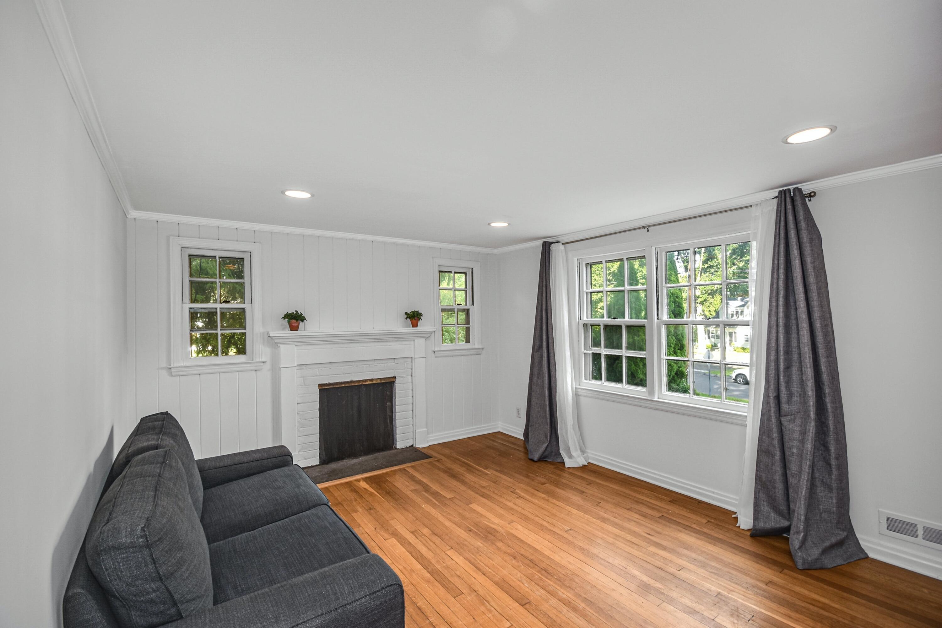 16 Burchard Lane Rowayton, CT 06853 - Photo 7 of 22 a living room with furniture and a fireplace