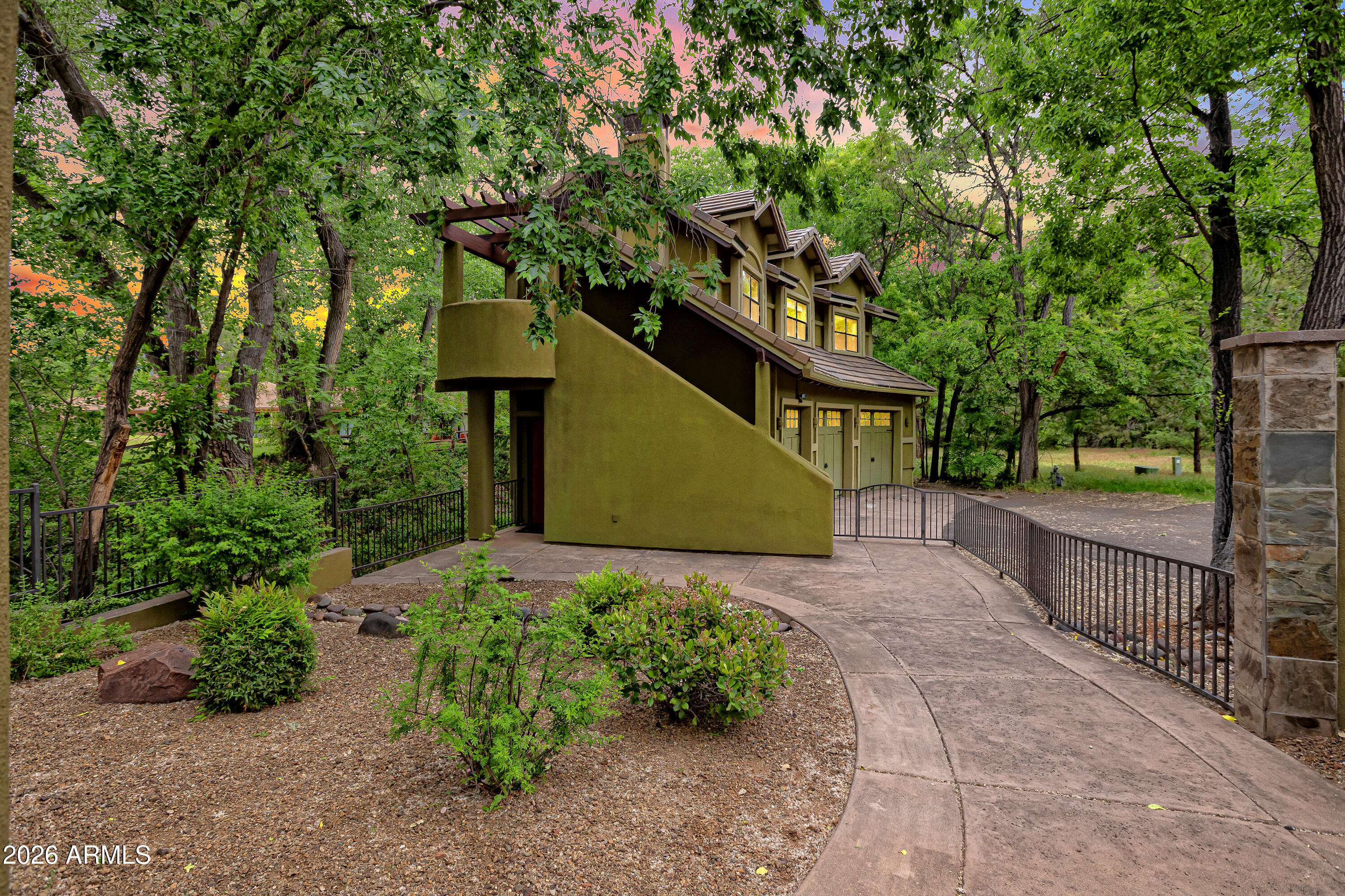 55 Ranch House Circle Sedona, AZ 86336 - Photo 40 of 61 a front view of a house with garden